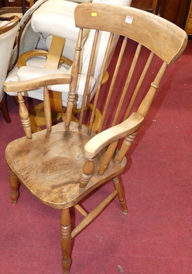 Lot 1321 - An early 20th century elm seat and beech...