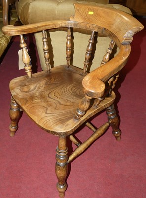 Lot 1338 - An elm and beech tub captain's chair, w.67cm