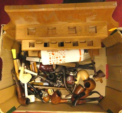 Lot 673 - A box of various smoking pipes to include clay...