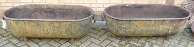 Lot 1411 - A pair of large cast iron garden planters by...