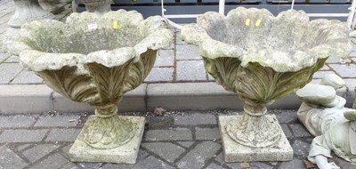 Lot 1420 - A pair of reconstituted stone pedestal garden...