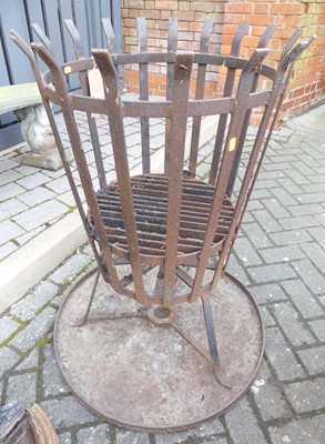 Lot 1426 - An iron strapwork garden brazier of circular...