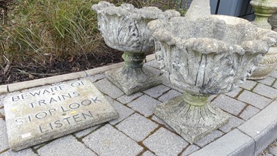 Lot 1441 - A pair of reconstituted garden pedestal leaf...