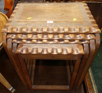 Lot 1358 - An Indian teak nest of four occasional tables,...