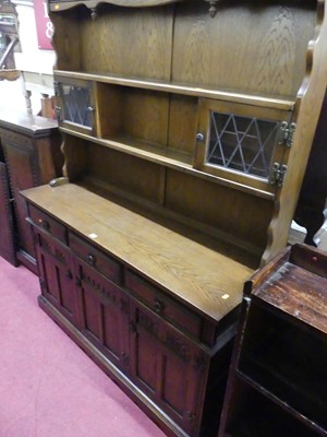 Lot 1377 - An Old Charm oak dresser, the upper section...