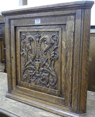 Lot 1379 - A small early 20th century relief carved oak...