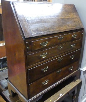 Lot 1390 - An 18th century provincial oak slopefront...