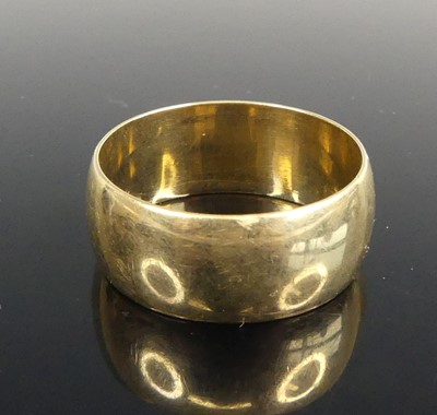 Lot 426 - A 9ct gold wide wedding band, size X, band w.9....