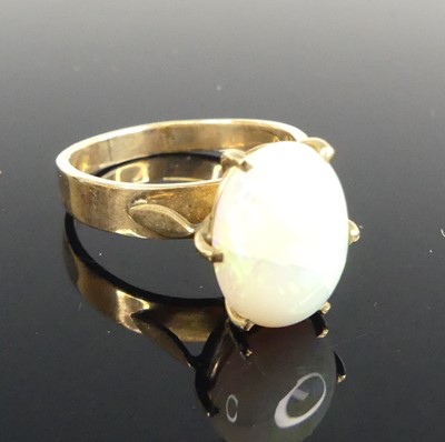 Lot 431 - A yellow metal opal set dress ring, the opal...