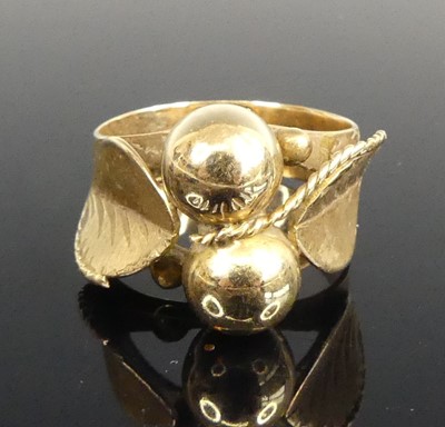 Lot 434 - A yellow metal dress ring, the plain band...