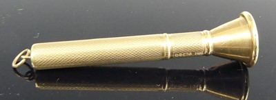 Lot 440 - A 9ct gold engine turned cigar piercer, with...