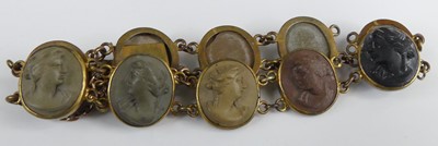 Lot 448 - A gilt metal and carved lava cameo bracelet, 17cm