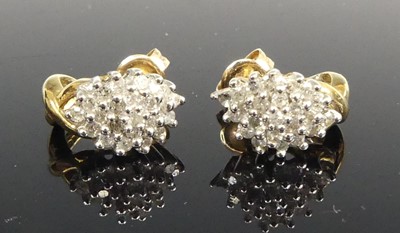 Lot 457 - A pair of modern 9ct gold diamond ear studs,...