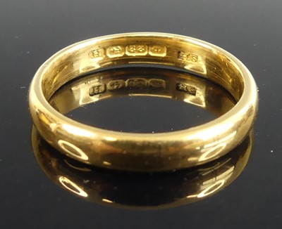 Lot 485 - A 22ct gold court shaped wedding band, sponsor...