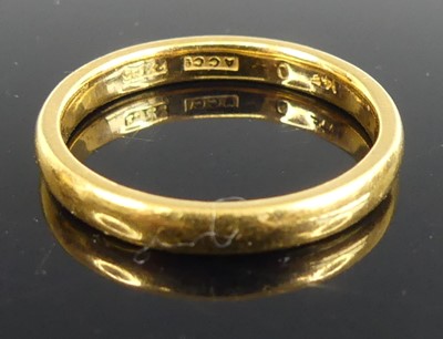 Lot 486 - A 22ct gold court shaped wedding band, sponsor...