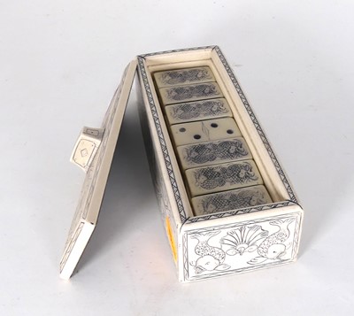 Lot 564 - A set of composite dominoes in a fitted box,...