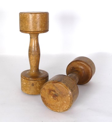 Lot 566 - A pair of treen dumbells width 17cm