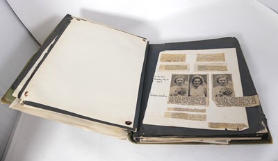 Lot 587 - An early 20th century photograph album,...