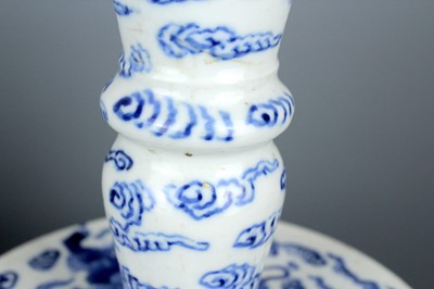 Lot 2023 - A pair of Chinese blue and white candle stands,...