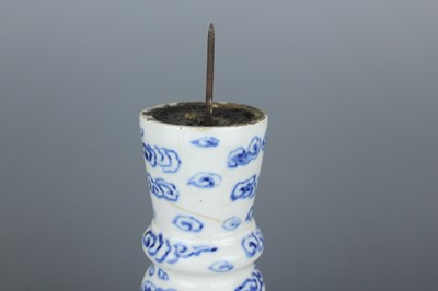 Lot 2023 - A pair of Chinese blue and white candle stands,...