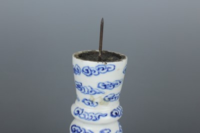 Lot 2023 - A pair of Chinese blue and white candle stands,...