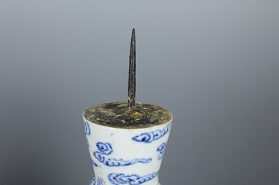 Lot 2023 - A pair of Chinese blue and white candle stands,...