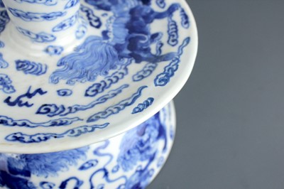 Lot 2023 - A pair of Chinese blue and white candle stands,...