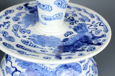 Lot 2023 - A pair of Chinese blue and white candle stands,...