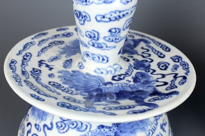 Lot 2023 - A pair of Chinese blue and white candle stands,...