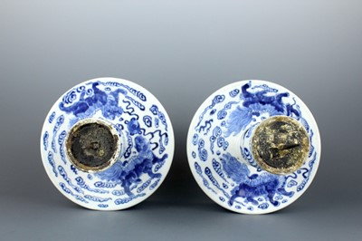 Lot 2023 - A pair of Chinese blue and white candle stands,...