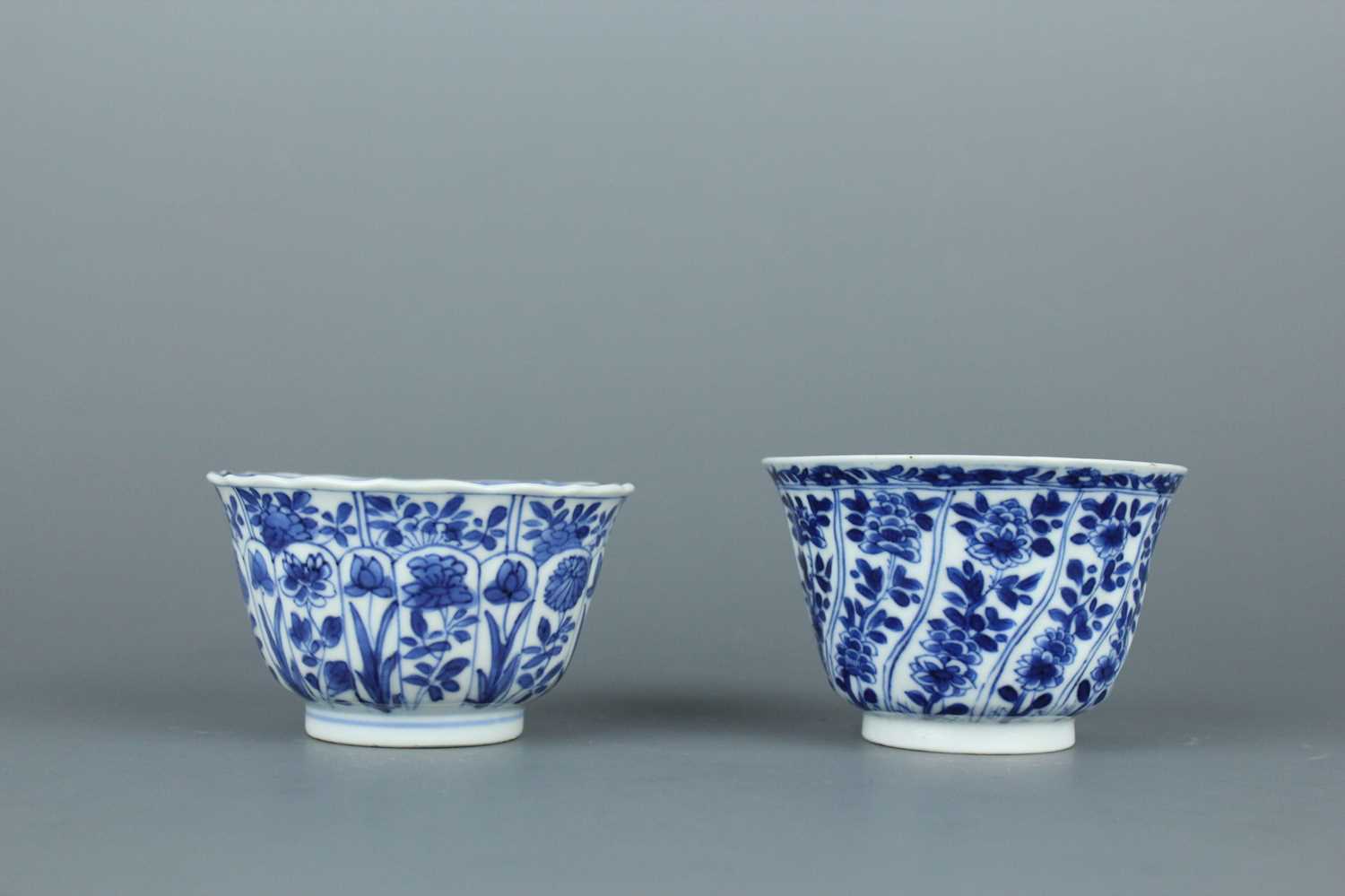 Lot 2043 - A near pair of Chinese blue and white cups,...