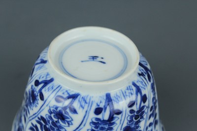Lot 2043 - A near pair of Chinese blue and white cups,...