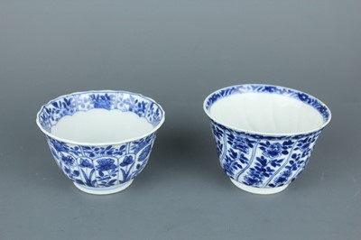 Lot 2043 - A near pair of Chinese blue and white cups,...