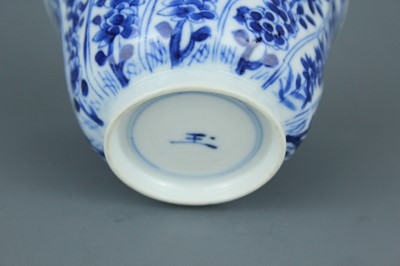 Lot 2043 - A near pair of Chinese blue and white cups,...