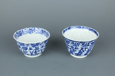 Lot 2043 - A near pair of Chinese blue and white cups,...
