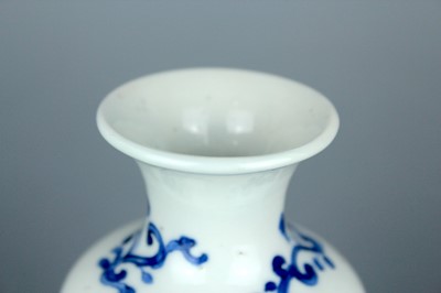 Lot 2038 - A small Chinese blue and white sleeve vase,...