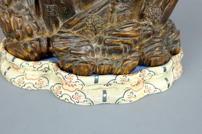 Lot 2087 - A Chinese wood-carved landscape brush pot,...