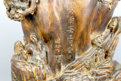 Lot 2087 - A Chinese wood-carved landscape brush pot,...