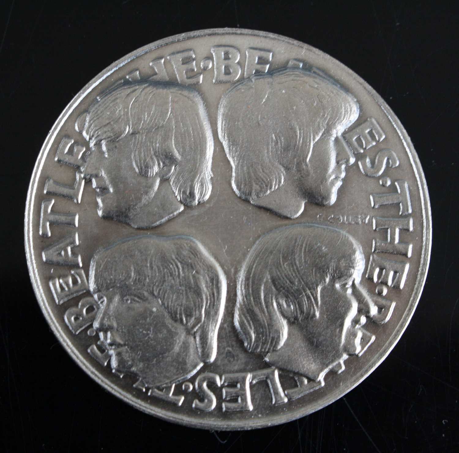 Lot 692 - The Beatles, a 1966 silver medal, obv:...