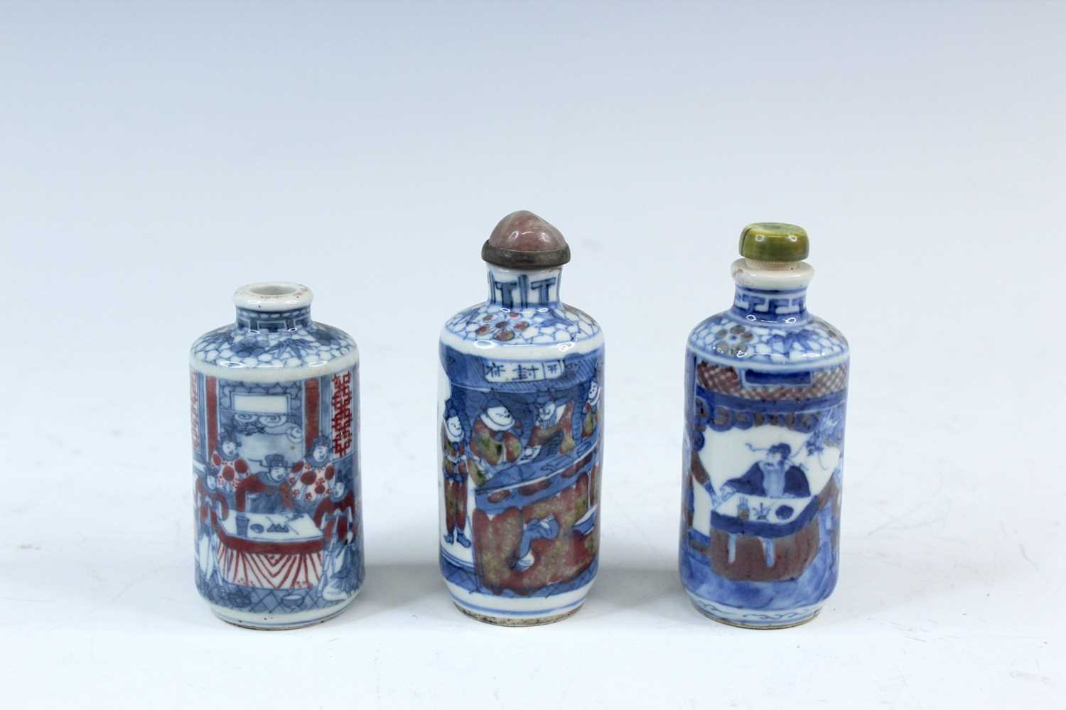 Lot 2001 - Three Chinese underglaze blue and red snuff...
