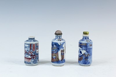 Lot 2001 - Three Chinese underglaze blue and red snuff...