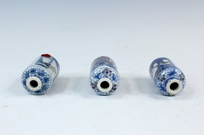Lot 2001 - Three Chinese underglaze blue and red snuff...