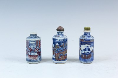Lot 2001 - Three Chinese underglaze blue and red snuff...
