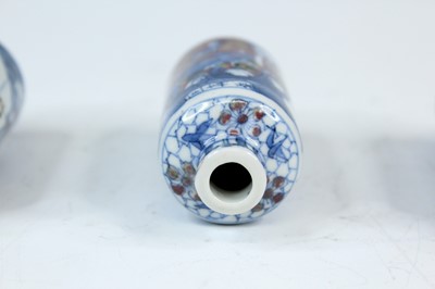 Lot 2001 - Three Chinese underglaze blue and red snuff...
