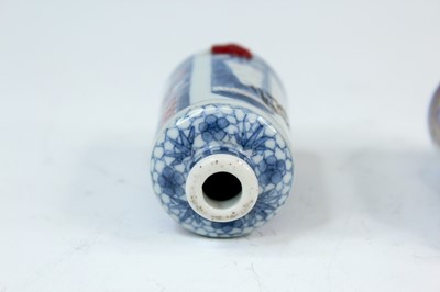 Lot 2001 - Three Chinese underglaze blue and red snuff...