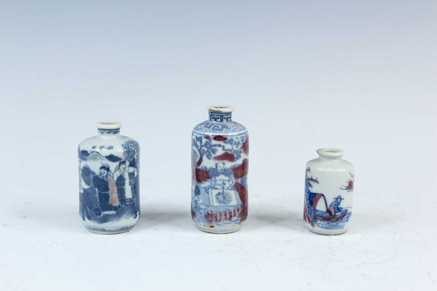 Lot 2002 - Three Chinese underglaze blue and red snuff...