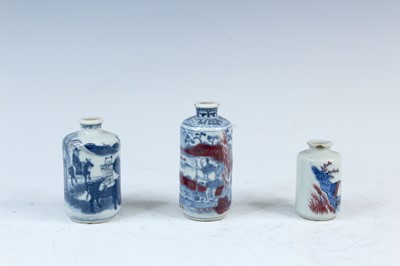 Lot 2002 - Three Chinese underglaze blue and red snuff...