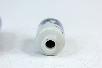 Lot 2002 - Three Chinese underglaze blue and red snuff...