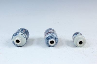 Lot 2002 - Three Chinese underglaze blue and red snuff...