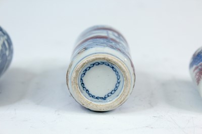 Lot 2002 - Three Chinese underglaze blue and red snuff...